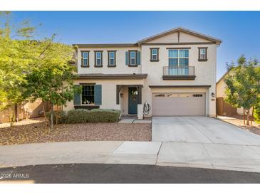 Two-story home featuring a charming front yard and an attached two-car garage at 98 N Bay Dr, Gilbert, AZ 85233