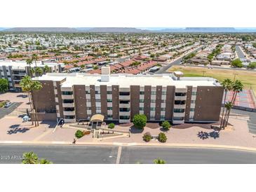Attractive condo building with a well-maintained entrance, landscaping, and visible balconies at 515 S Parkcrest -- # 531, Mesa, AZ 85206