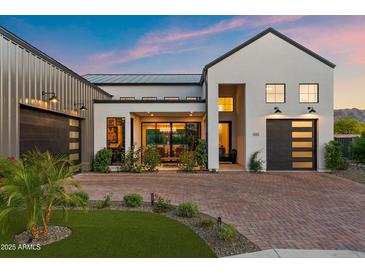 Beautiful modern home with manicured landscaping, brick driveway, and attached two-car garage at 1013 W Ardmore Rd, Phoenix, AZ 85041