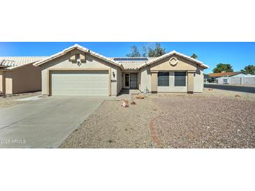Charming single-story home featuring a low-maintenance yard and a two-car garage at 19808 N 3Rd Ave, Phoenix, AZ 85027