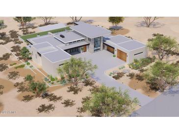 An aerial view of a modern, desert home with a flat roof, stone accents, and desert landscaping at 3648 N Sky Point Cir, Mesa, AZ 85207