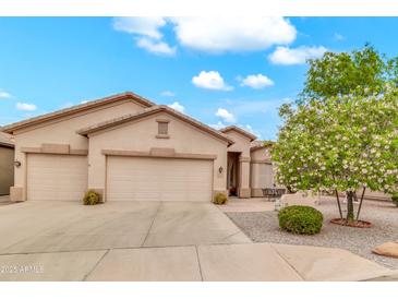 Charming single-story home boasts a well-manicured lawn and a three-car garage, perfect for comfortable living at 6141 S Bradshaw Way, Chandler, AZ 85249