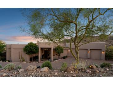 Charming home with desert landscaping, a brick driveway, and a mountain backdrop at 15045 E Sundown Dr, Fountain Hills, AZ 85268
