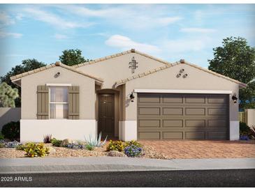 Charming single-story home with a two-car garage, desert landscaping, and neutral color palette at 137 N 175Th Ln, Goodyear, AZ 85338