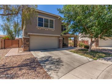 Two-story home with neutral stucco, stone accents and a 2 car garage at 17235 W Statler St, Surprise, AZ 85388