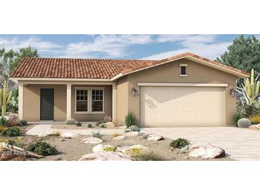 Charming single-story home featuring desert landscaping, a tile roof and neutral paint scheme at 19321 W Luke Ave, Litchfield Park, AZ 85340