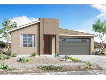 Charming single-story home with desert landscaping and a gray garage door at 24179 W Agora Ln, Buckeye, AZ 85326