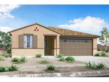 Charming single-story home with a tile roof, stucco siding, desert landscaping and a two-car garage at 24191 W Agora Ln, Buckeye, AZ 85326