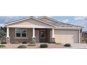 Charming single-story home featuring stone accents, neutral colors, and a two-car garage at 32101 N Lone Rancher Way, San Tan Valley, AZ 85140