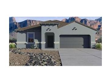 Inviting single-story home featuring a gray exterior, neutral trim, desert landscaping, and a two-car garage at 9943 S Desert View Dr, Apache Junction, AZ 85120