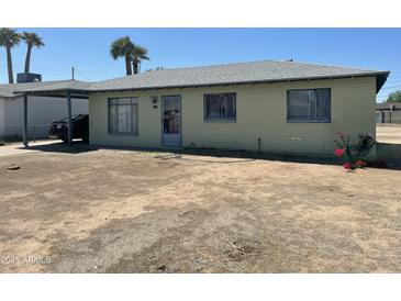 Charming single-story home with a spacious front yard and covered parking at 4410 N 50Th Dr, Phoenix, AZ 85031