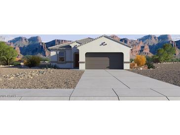 Charming single-story home showcasing desert landscaping and a spacious two-car garage at 5575 E Mearn Rd, San Tan Valley, AZ 85140