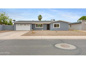 Charming single-story home with a well-maintained xeriscaped front yard and a convenient two-car garage at 845 W Shannon St, Chandler, AZ 85225