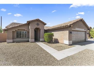 Charming single-story home with desert landscaping, tile roof, and inviting entrance at 10747 W Via Del Sol --, Peoria, AZ 85373