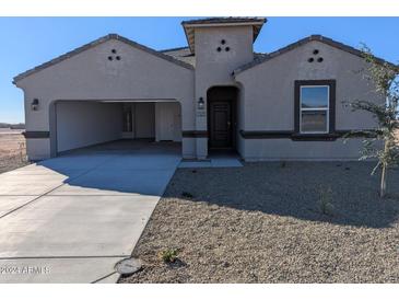 Charming single-story home featuring low maintenance desert landscaping and a convenient two-car garage at 18795 E Bruno Dr, Gold Canyon, AZ 85118