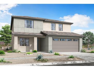 Charming two-story home showcasing a neutral color palette, attached garage, and low maintenance desert landscaping at 24232 W Agora Ln, Buckeye, AZ 85326