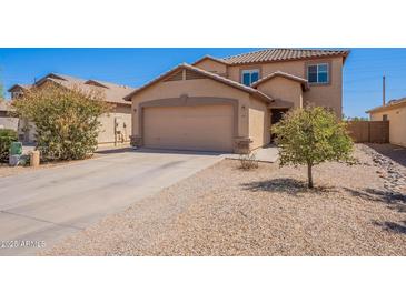 Charming two-story home with a well-maintained front yard and attached two-car garage at 5305 E Silverbell Rd, San Tan Valley, AZ 85143