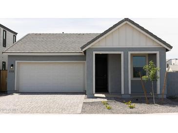 Charming home featuring a grey exterior, two-car garage, and covered entry at 5920 S Daisy Patch Pl, Phoenix, AZ 85040