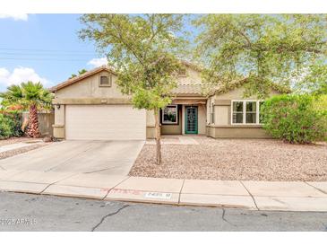 Charming single-story home featuring a two-car garage and inviting front yard landscaping at 7425 N 75Th Dr, Glendale, AZ 85303
