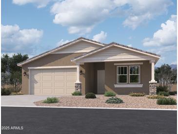 Charming single-story home featuring a two-car garage and inviting front porch at 9544 W Parkway Dr, Tolleson, AZ 85353