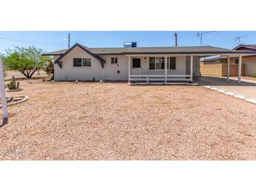 Charming single-story home with desert landscaping and covered parking at 126 N 58Th St, Mesa, AZ 85205