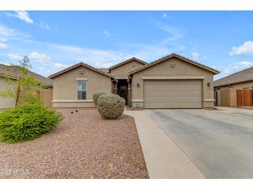 Beautiful home with a two-car garage, desert landscaping, and modern design elements at 2148 W Angelo Way, San Tan Valley, AZ 85144
