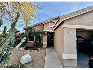 Charming single-story home featuring desert landscaping and a welcoming front entrance at 10705 W Montecito Ave, Phoenix, AZ 85037
