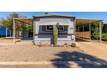 Charming gray home with desert landscaping, covered parking, and number 29 clearly displayed at 2650 W Union Hills Dr # 29, Phoenix, AZ 85027
