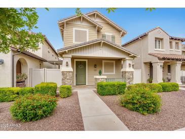 Charming two-story home with a well-maintained front yard and welcoming entrance at 1069 S Nancy Ln, Gilbert, AZ 85296