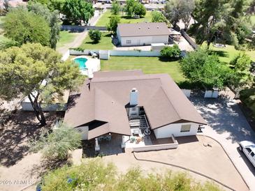 Aerial view of the property, showcasing a covered patio, well-maintained landscaping, and ample outdoor space at 2331 E Melrose St, Gilbert, AZ 85297