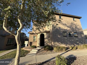 Inviting two-story home with a stone-accented entryway and well-maintained landscaping at 1730 W Pollack St, Phoenix, AZ 85041