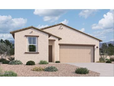 Charming single-story home with a neutral stucco finish, attached two-car garage, and well-maintained desert landscaping at 47719 W Kenner Dr, Maricopa, AZ 85139
