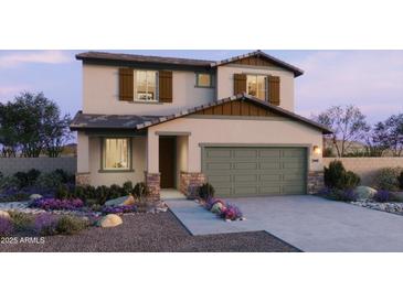Charming two-story home with a two-car garage, landscaped front yard, and neutral color palette at 15634 W Hackamore Dr, Surprise, AZ 85387