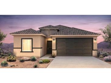 Charming single-story home featuring a two-car garage, desert landscaping, and a neutral-toned exterior at 25200 W Wier Ave, Buckeye, AZ 85326