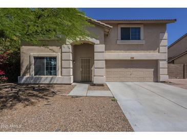 Charming two-story home featuring a two-car garage and well-maintained front yard at 3018 W Horsham Dr, Phoenix, AZ 85027