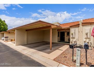 Charming home featuring a carport and well-maintained landscaping at 13408 N 25Th Dr, Phoenix, AZ 85029