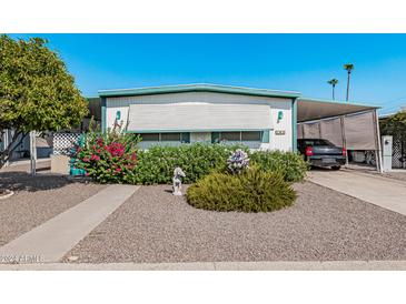 Charming single-story home with tidy landscaping, covered parking, and cheerful curb appeal at 2650 W Union Hills Dr # 164, Phoenix, AZ 85027