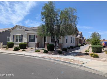 Inviting single-story home with a charming desert landscaped front yard on a sunny day at 324 N 56Th Pl, Mesa, AZ 85205