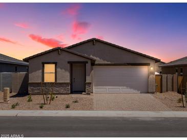 Inviting single-story home with a brick driveway, two-car garage, and desert landscaping at 4226 W Lisa Ln, San Tan Valley, AZ 85144