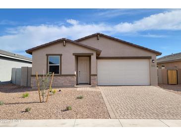 Charming single-story home with a desert-landscaped front yard and a two-car garage at 4226 W Lisa Ln, San Tan Valley, AZ 85144
