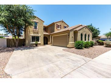 Inviting two-story home with a spacious driveway, neutral exterior, and well-maintained landscaping at 4322 S Ranger Trl, Gilbert, AZ 85297
