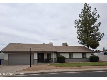 Charming single-story home with a well-manicured lawn and inviting curb appeal at 740 N Oracle --, Mesa, AZ 85203