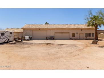 This home features a large garage with two bays and a convenient side entry door at 2131 E Rose Garden Ln, Phoenix, AZ 85024