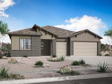 Charming single-story home showcasing brick accents, a three-car garage, and desert landscaping at 278 W Flax Dr, San Tan Valley, AZ 85140