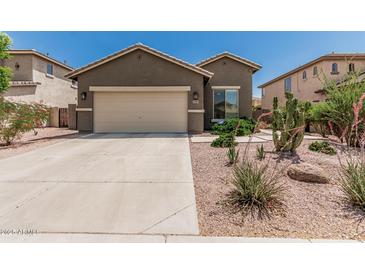 Charming single-story home featuring a two-car garage and desert landscaping in a sunny neighborhood at 3349 E Merlot St, Gilbert, AZ 85298