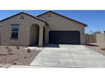 Charming single-story home with a large driveway and desert landscaping at 3948 E San Jose St, San Tan Valley, AZ 85143