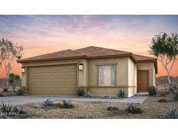 Charming single-story home featuring a two-car garage, desert landscaping, and a neutral color palette at 42875 W Vincent Dr, Maricopa, AZ 85138
