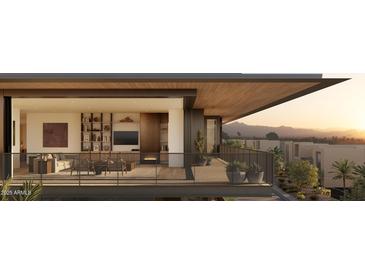 A contemporary living room with modern fireplace and sliding doors to a view balcony at 5050 N Camelback Ridge Dr # 1301, Scottsdale, AZ 85251