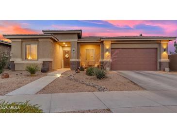 Charming single-story home with desert landscaping and a welcoming entryway at 22639 E Avenida Del Valle --, Queen Creek, AZ 85142