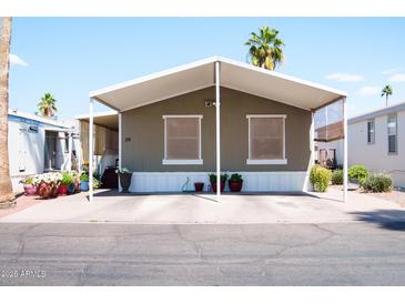 Charming home featuring desert landscaping, covered parking, and a welcoming facade at 501 E Ray Rd # 36, Chandler, AZ 85225